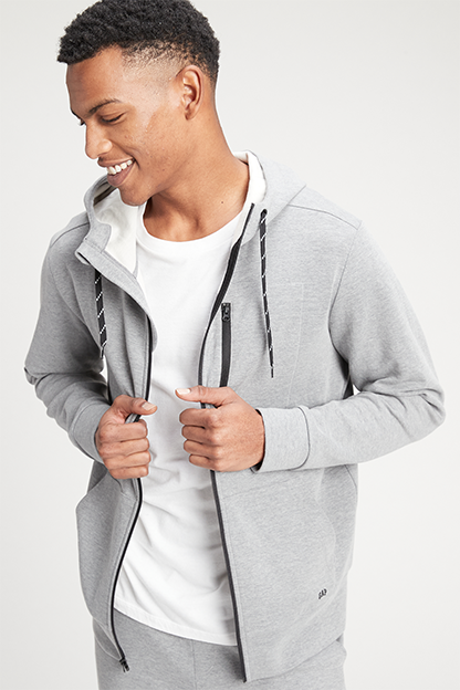 man wearing gray zip hoodie