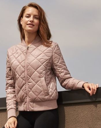 woman wearing Weatherproof HeatLast Quilted Packable Bomber, blush