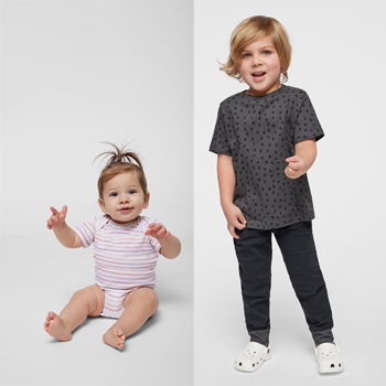 baby in striped onesie and toddler in spotted gray tee