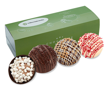 three hot chocolate bombs in branded sleeve